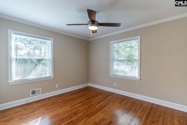 unfurnished room featuring ceiling fan, crown molding, and wood-type flooring