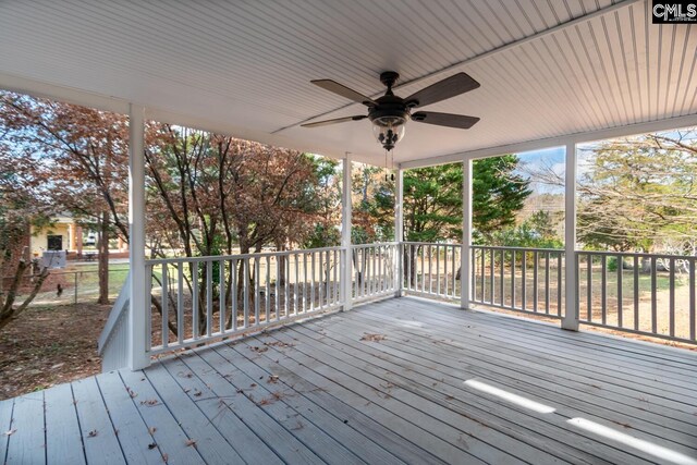 wooden deck with ceiling fan