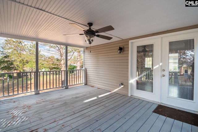 wooden deck featuring ceiling fan