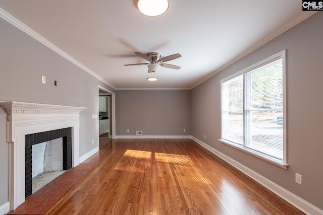 unfurnished living room featuring ornamental molding, light wood-type flooring, and ceiling fan