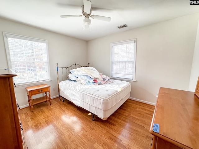 bedroom featuring ceiling fan and light hardwood / wood-style flooring