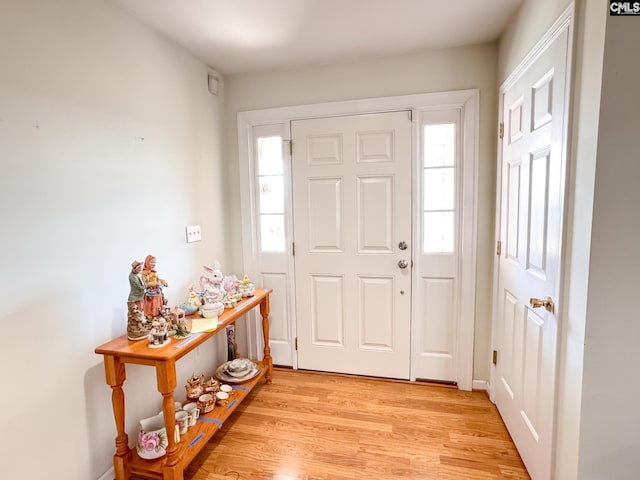 foyer entrance with light wood-type flooring