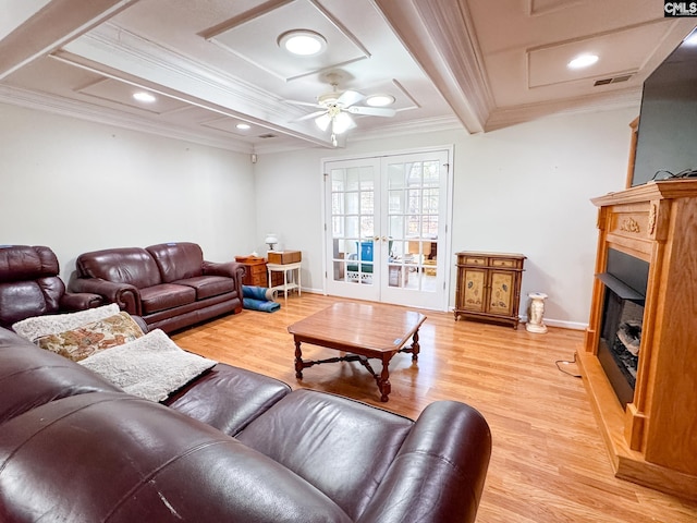 living room with ceiling fan, crown molding, beamed ceiling, and light hardwood / wood-style flooring