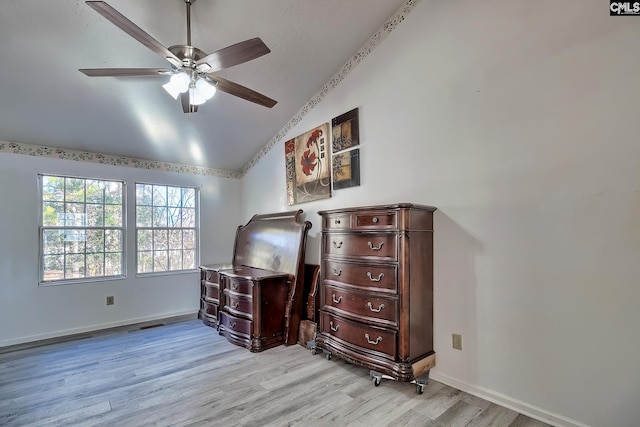 bedroom with lofted ceiling, light wood-type flooring, and ceiling fan