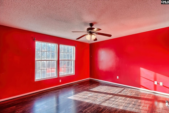 unfurnished room featuring ceiling fan, a textured ceiling, and hardwood / wood-style flooring