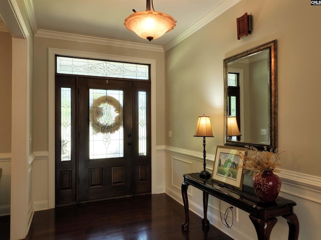 foyer entrance featuring ornamental molding and dark wood-type flooring