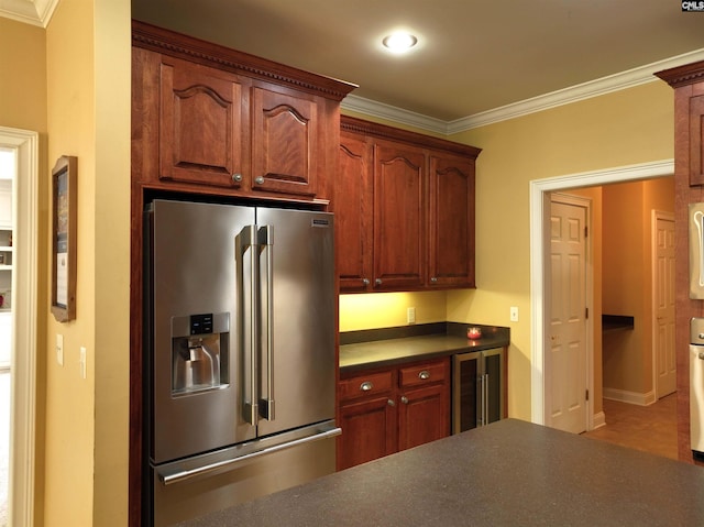 kitchen featuring white oven, crown molding, stainless steel refrigerator with ice dispenser, and wine cooler