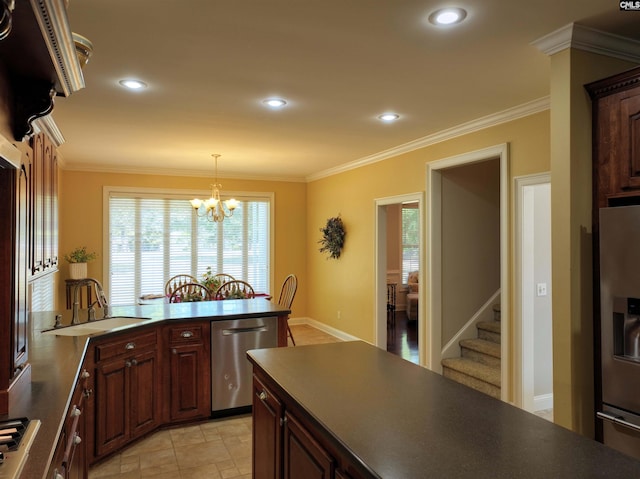 kitchen with stainless steel appliances, ornamental molding, pendant lighting, sink, and an inviting chandelier