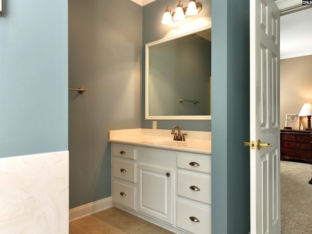 bathroom featuring crown molding and vanity