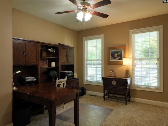 office area with ceiling fan, light carpet, and plenty of natural light