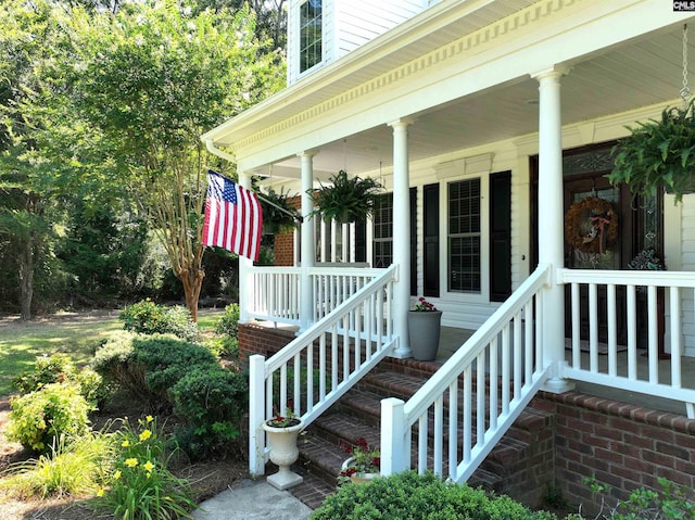 view of exterior entry with a porch