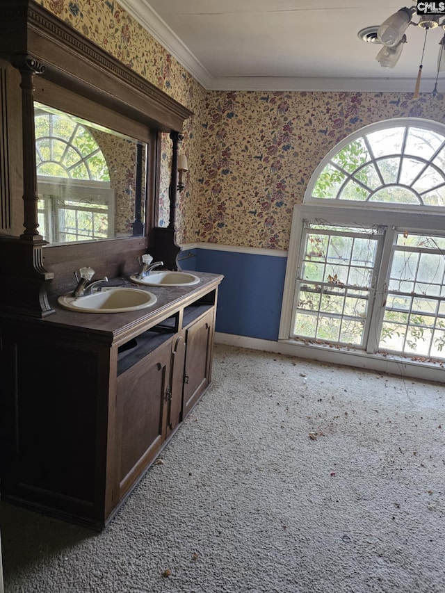 bathroom with vanity, ornamental molding, and ceiling fan