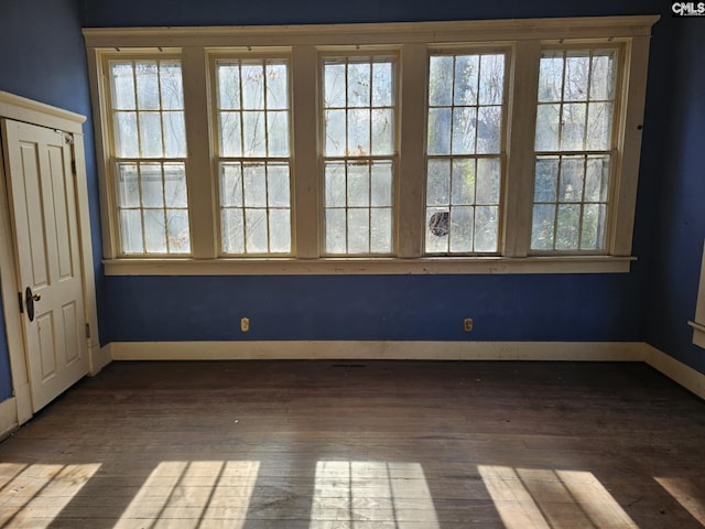 unfurnished room featuring dark hardwood / wood-style floors