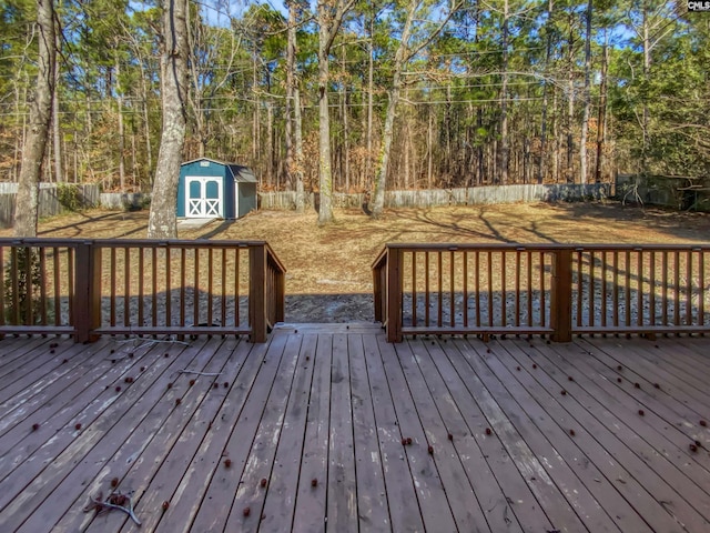 wooden terrace featuring a shed