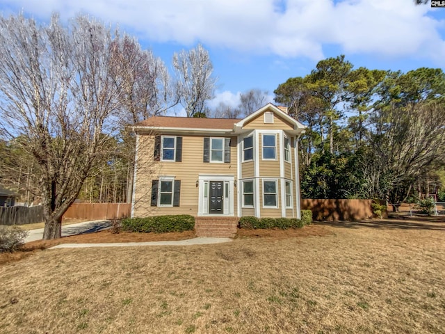 view of front of home featuring a front yard