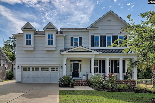 view of front of home with a garage and a porch