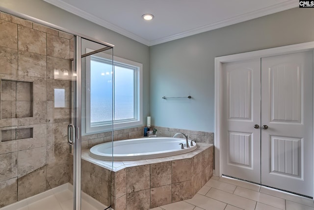 bathroom featuring independent shower and bath, ornamental molding, and tile patterned floors