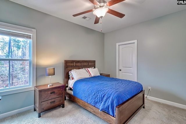 carpeted bedroom with ceiling fan