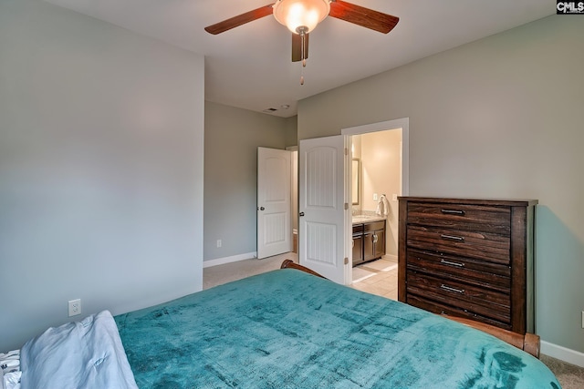 carpeted bedroom with connected bathroom and ceiling fan