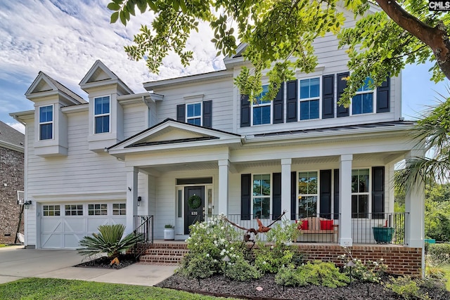 view of front of property featuring a porch and a garage