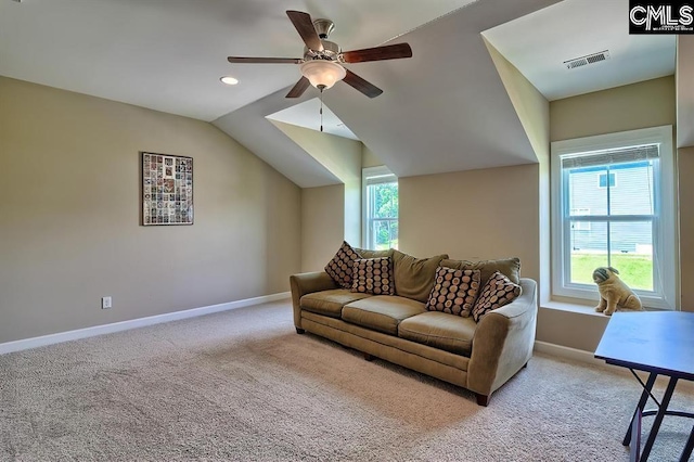 carpeted living room with lofted ceiling and ceiling fan