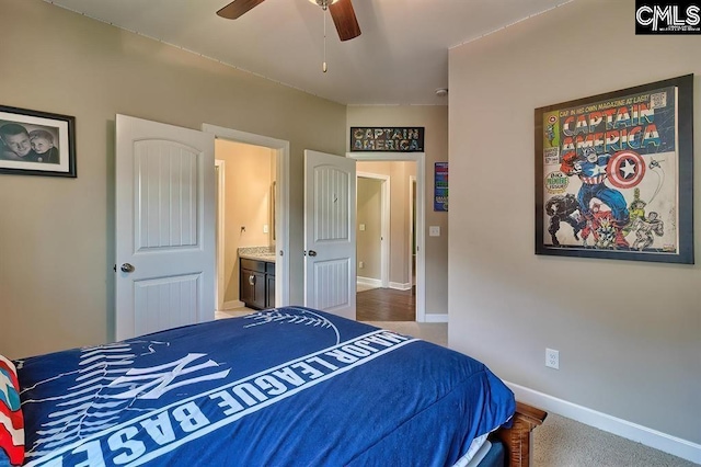 bedroom featuring ensuite bathroom and ceiling fan