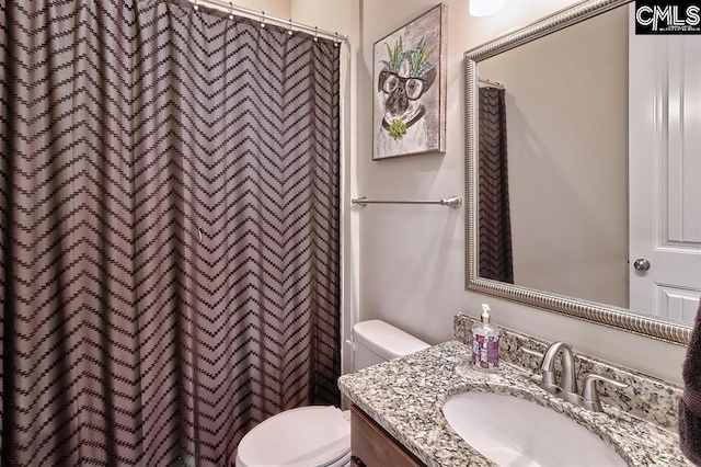 bathroom with vanity and toilet