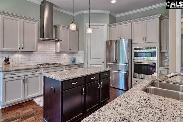 kitchen featuring appliances with stainless steel finishes, dark hardwood / wood-style floors, sink, ornamental molding, and wall chimney exhaust hood