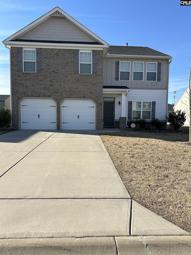 552 Sterling Ponds Dr, Blythewood, SC 29016 - view of front of property featuring driveway, an attached garage, board and batten siding, and brick siding