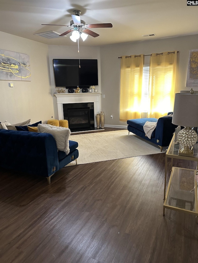 living room with ceiling fan and wood-type flooring