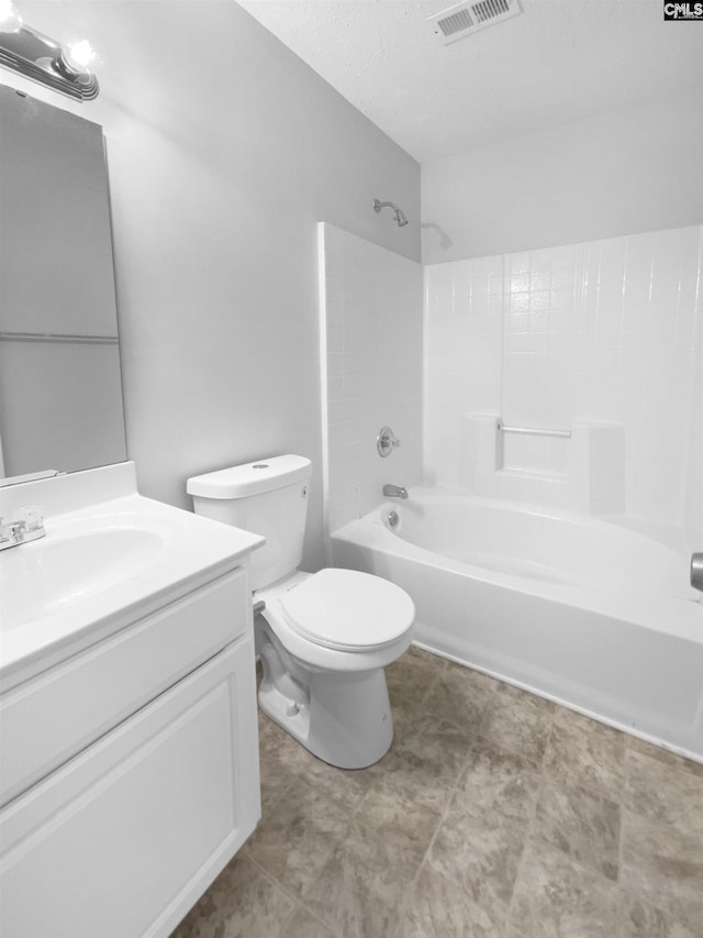 full bathroom featuring toilet, vanity, bathing tub / shower combination, and a textured ceiling