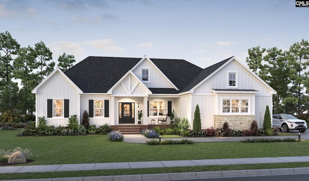 modern farmhouse featuring a front yard and covered porch