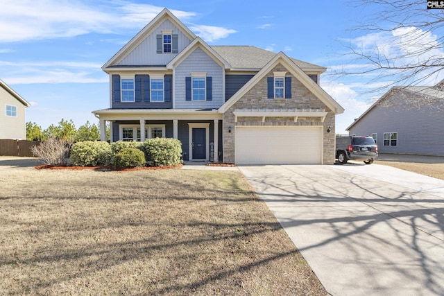 craftsman-style house with a front yard, a garage, and a porch