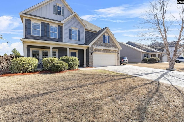 craftsman-style home with a front yard and a garage