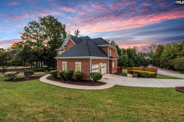 property exterior at dusk featuring a yard and a garage