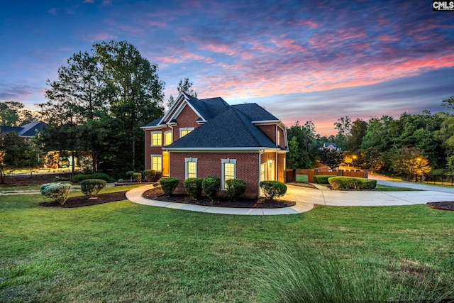 view of front of property with a yard