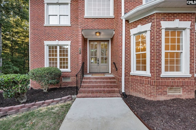 entrance to property featuring french doors