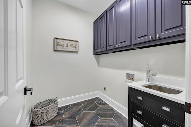 clothes washing area with sink, cabinets, hookup for an electric dryer, and washer hookup