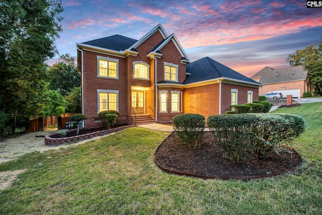 view of front of house with a lawn