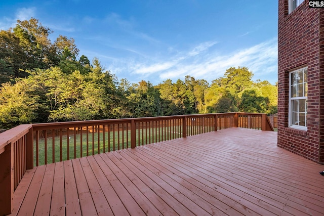 wooden deck with a yard