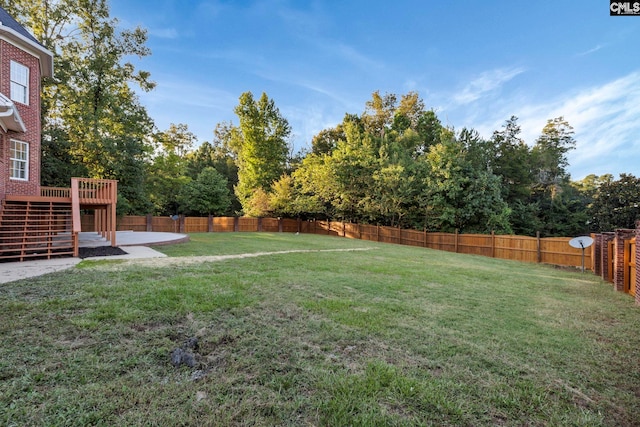 view of yard featuring a wooden deck