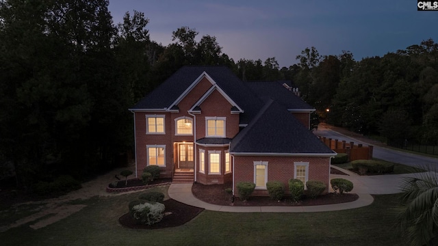 view of front of house with a yard