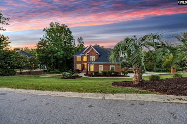 view of front of home with a lawn