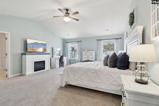 bedroom with lofted ceiling, carpet flooring, and ceiling fan