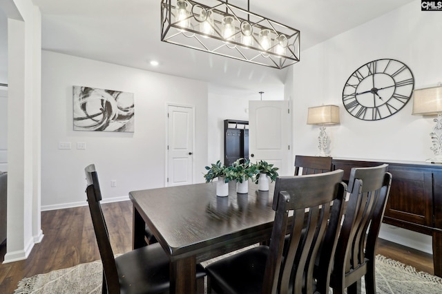 dining area featuring recessed lighting, wood finished floors, and baseboards