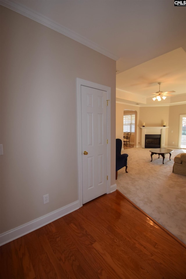 interior space with crown molding and wood-type flooring