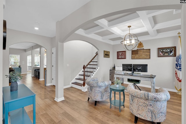 office with an inviting chandelier, beam ceiling, light wood-type flooring, and coffered ceiling