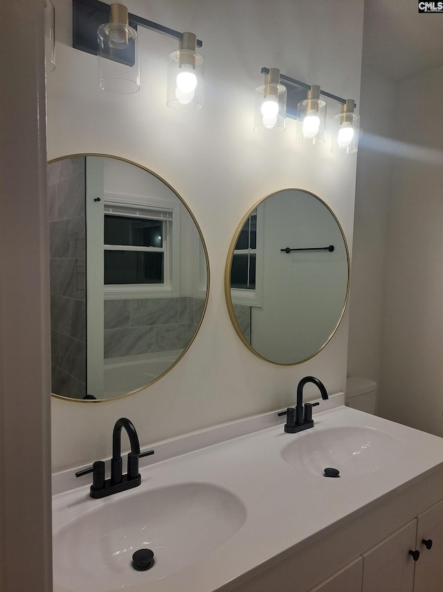 bathroom featuring vanity and toilet