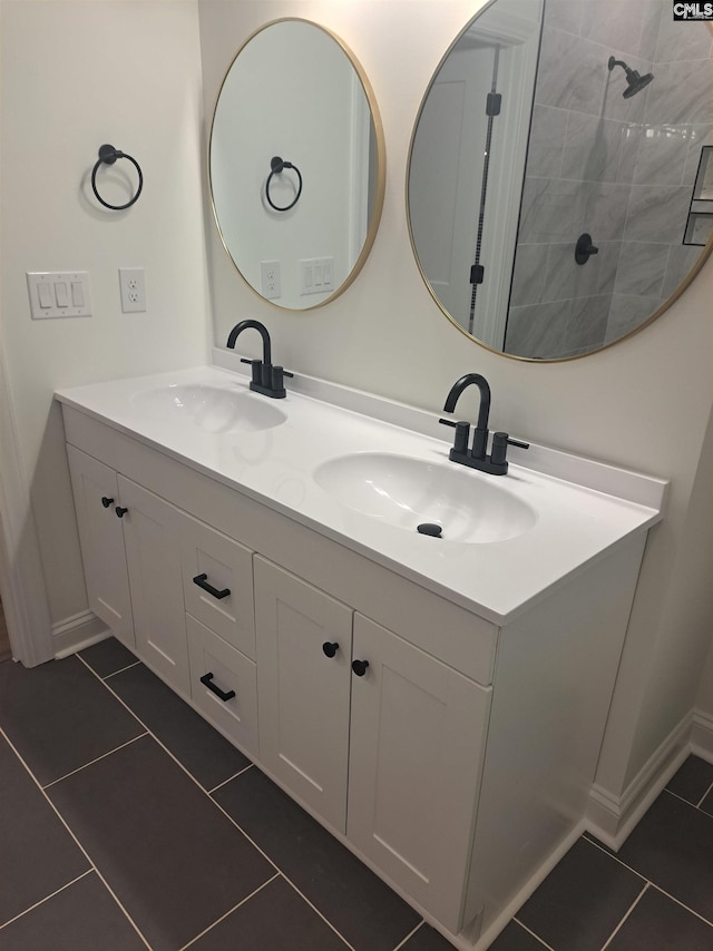 bathroom with tile patterned floors and vanity