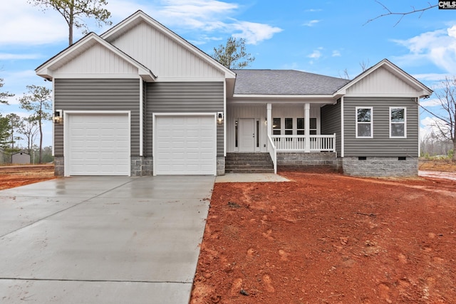 view of front of home featuring a garage and covered porch